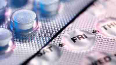 A closeup photo of birth control packs displaying the days of the week for each pill. Women with ADHD are at increased risk for developing depression with birth control use, according to a study.