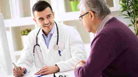 Doctor explaining the side effects of ADHD medications to his senior patient