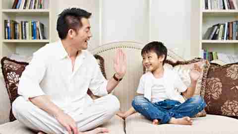 Father and son sitting on couch and discussing the side effects of his ADHD medication