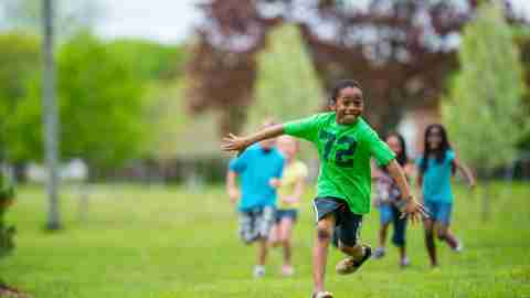 Boy running through a field, without side effects from his ADHD medication