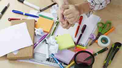 A messy desk in the messy house of someone with ADHD