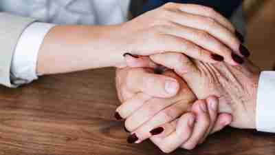 A woman and a man hold hands while talking about ADD and relationships.