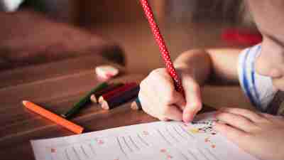 Child working in classroom with learning disabilties