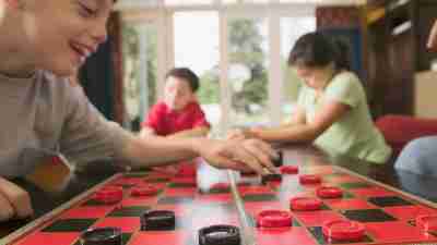 Family playing checkers