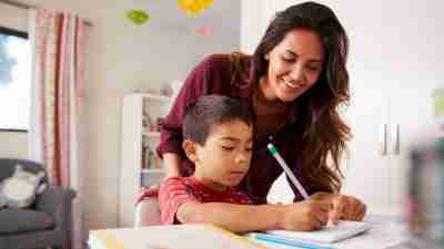 Mother Helping Son With Homework