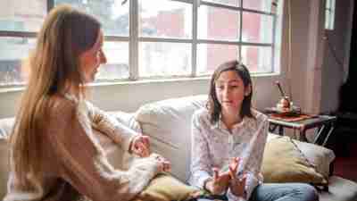 Mother and daughter at home having a  talk at home