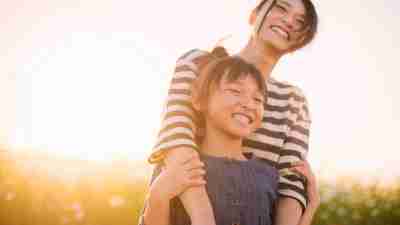 Sunset time,Mother and daughter with Cosmos flowers,Girl of 7 years old,Japanese family,Japan