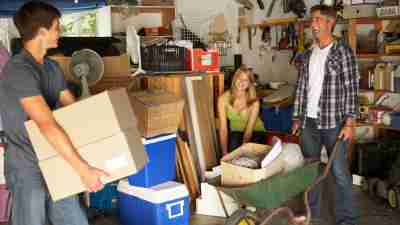 How to get organized: A family clearing out a garage together