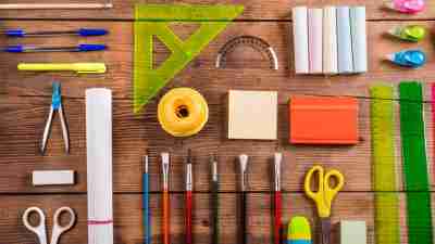 Wooden desk with school supplies neatly laid out belonging to ADHD student
