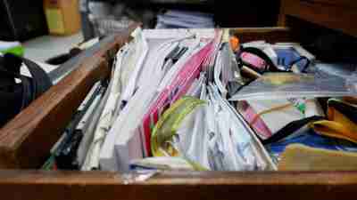 Opened drawer wooden table at  workplace