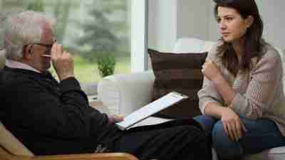 Girl in doctors office to treat depression